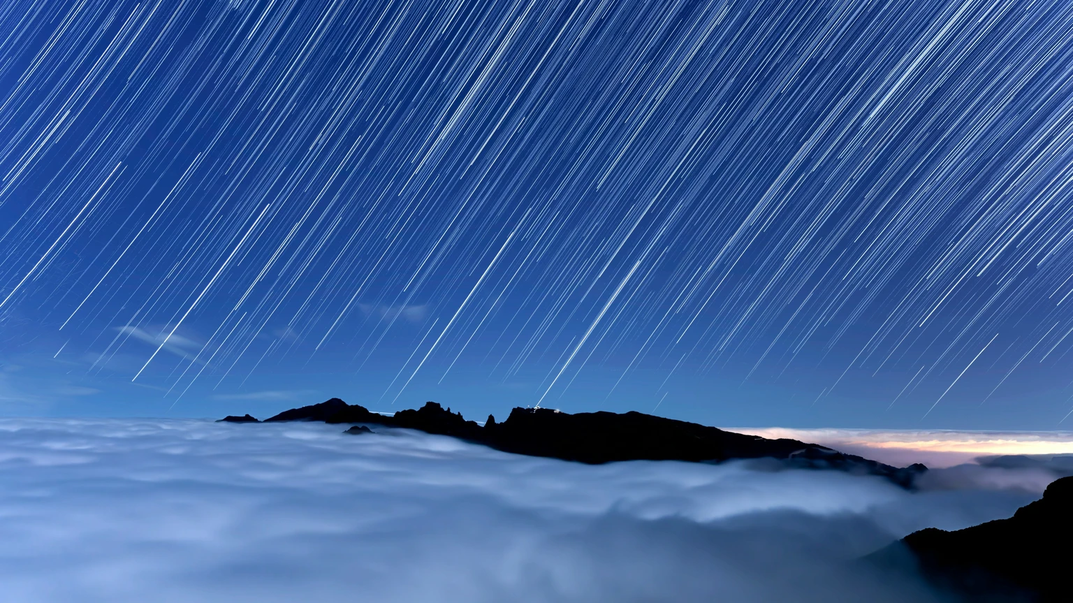 Star Trails Over a Sea of Clouds